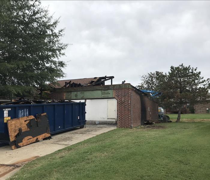 Exterior view of a garage of a fire damaged home